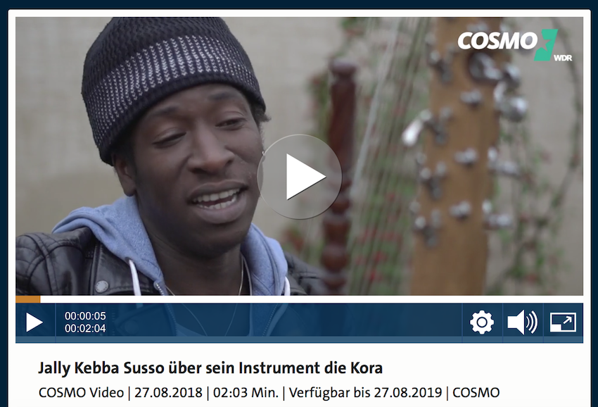 Jally Kebba Susso playing kora and interviewing with COSMO WDR at Shambala Festival